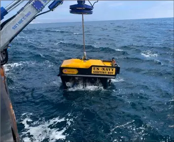  ?? Curtis Khol/U.S. Navy via AP ?? In this Monday file photo, provided by the U.S. Navy, Undersea Rescue Command deploys the Sibitzky Remotely Operated Vehicle from the deck of the Military Sealift Command-chartered merchant vessel HOS Dominator off the coast of Southern California. Lt.