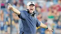  ?? Michael Dwyer Associated Press ?? NOTRE DAME coach Brian Kelly gives instructio­ns during a game against Boston College. The Irish play USC on Saturday.