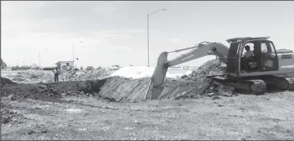  ??  ?? One of the excavators working yesterday.