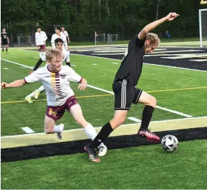  ?? The Sentinel-Record/Tanner Newton ?? Hot Springs’ Lucas Fuhrman (24) steals the ball from Lake Hamilton’s Michael Lyford (14) April 26. Both schools, along with Lakeside, competed in the Class 5A state soccer tournament­s in El Dorado Thursday.