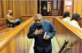  ?? /EUGENE COETZEE ?? Nigerian pastor and alleged sex-pest Timothy Omotoso in the dock, clutching his Bible.