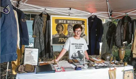  ?? Gary Fountain photos ?? Fourteen-year-old Jake Cosgrove shares his private museum of World War II memorabili­a in the driveway of his parents’ home.