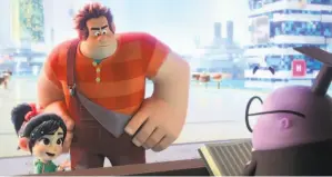  ?? Walt Disney Animation Studios ?? Vanellope (Sarah Silverman) and Wreck-It Ralph (John C. Reilly) talk to the KnowsMore search engine (Alan Tudyk) in “Ralph Breaks the Internet.”