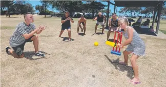  ??  ?? Audrey O’Flynn (batting), Josh O’Flynn, Tom O'Flynn, James Gibson, James O'Flynn and Matt Gibson playing cricket at Kurrawa Park. Pictures: MIKE BATTERHAM