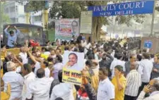  ?? SONU MEHTA/HT ?? DMK supporters celebrate the verdict in the 2G scam case outside the Patiala House Court in New Delhi on Thursday.