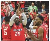  ??  ?? Red Scare players, including Kendall Pollard and Vee Sanford, thank fans after a loss to Carmen’s Crew in the third round of The Basketball Tournament on Sunday at Capital University in Bexley.