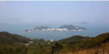  ??  ?? A general view of Peng Chau island and nearby islands, viewed from Lantau, where an East Lantau Metropolis project is proposed by the government, in Hong Kong. — Reuters photo