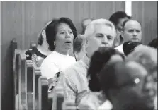  ?? Associated Press/DESMOND BOYLAN ?? Esther Zulueta (left), doctor and member of the William Carey Baptist Church, attends Sunday worship last month in Havana, Cuba. The church council estimates there are about 25,000 evangelica­l and other Protestant houses of worship across the country.