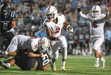  ?? Barry Reeger/For the Post-Gazette ?? Moon’s Jeremiah Dean scores a second quarter touchdown.