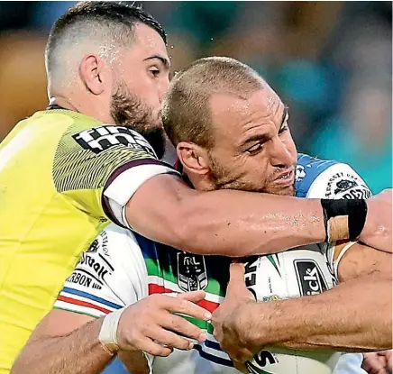  ??  ?? The Broncos’ Jack Bird goes high to stop the progress of Simon Mannering.