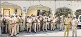  ?? ANI ?? Police personnel stand guard near Kali Devi Temple following the clash between two groups, in Patiala on Saturday.