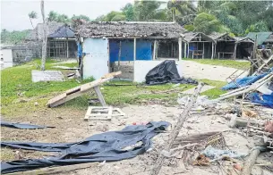  ??  ?? Badly damaged buildings are seen near Vanuatu’s capital of Port Vila yesterday.