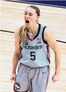  ?? ERIC GAY/ASSOCIATED PRESS ?? UConn guard Paige Bueckers, who scored 28 points, celebrates against Baylor during the second half at the Alamodome in San Antonio on Monday.