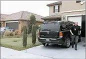  ?? ALEX GALLARDO/AP ?? A detective walks next to a home where police arrested the Turpins in Perris, 60 miles southeast of Los Angeles.