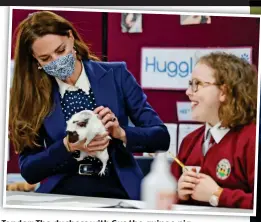  ??  ?? Tender: The duchess with Gus the guinea pig