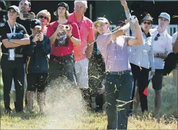  ?? Photograph­s by Gina Ferazzi Los Angeles Times ?? CO-LEADER Patrick Cantlay blasts out of the rough after hitting an errant tee shot on the ninth hole.