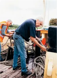  ??  ?? Volunteer Colin Leonard working the ropes in his new role as crew member.