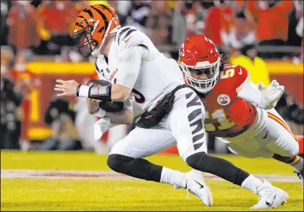  ?? Ed Zurga The Associated Press ?? Defensive end Mike Danna sacks Joe Burrow, one of five times the Chiefs put the Bengals quarterbac­k on the ground in the AFC title game.