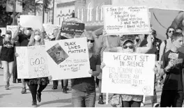  ?? RICARDO RAMIREZ BUXEDA/ORLANDO SENTINEL ?? Protests like this one in Kissimmee show the growing movement for police to rethink how they go about their jobs.