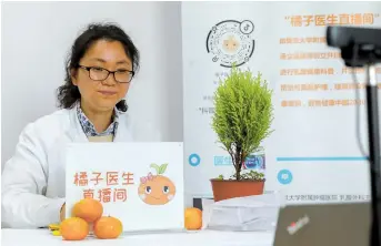  ??  ?? Shanghai Cancer Center’s Dr Tang Lichen has opened a livestream­ing channel to share informatio­n about breast cancer and promote public awareness of the disease and its treatment. — Jiang Xiaowei