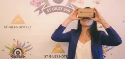  ?? ST GILES HOTELS ?? Abigail Tan, head of St Giles U.S.A, U.K. and Europe, uses a virtual-reality headset.