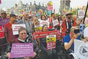  ?? Chris J. Ratcliffe, Getty Images ?? Boris Johnson protesters attend a rally Thursday with Labour Party leader Jeremy Corbyn, calling for a general election.