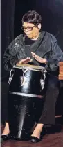  ??  ?? Marcia Rowe/Gleaner Writer Marjorie Whylie plays the drum.