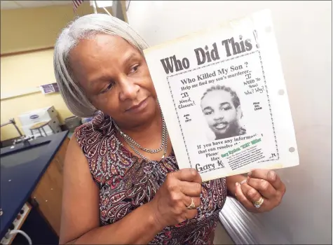  ?? Arnold Gold / Hearst Connecticu­t Media ?? Marlene Pratt holds a poster seeking informatio­n about the May 20, 1998, killing of her son, Gary Kyshon ‘Kiki” Miller.