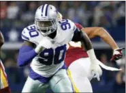  ?? RON JENKINS — THE ASSOCIATED PRESS FILE ?? Dallas Cowboys defensive end Demarcus Lawrence (90) gets off the line during a game against the Washington Redskins earlier this season.