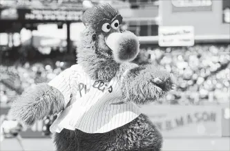  ?? ASSOCIATED PRESS FILE PHOTO ?? Kathy McVay says she was at Phillies game on June 18 when the Phillie Phanatic, rolled out his hot dog launcher and all of a sudden she says a hot dog wrapped in duct tape struck her in the face.
She left the game to get checked out at a hospital, and...