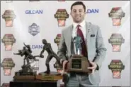  ?? JOHN AMIS — THE ASSOCIATED PRESS ?? Oklahoma quarterbac­k Baker Mayfield holds the Maxwell Award trophy as he stands next to the Walter Camp and Davey O’Brien awards, which he also won, during the College Football Awards show at the College Football Hall of Fame, Thursday in Atlanta.