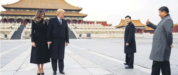  ??  ?? President Trump and first lady Melania Trump visit the Forbidden City with Chinese President Xi Jinping, Beijing, China, Nov. 8.
