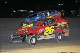  ??  ?? Ryan Godown (26) and Ryan Watt (14) duel during the STSS modified feature on Oct. 28 at Georgetown Speedway. Godown won the race while Watt, the runner-up, was crowned STSS South Region champion. (Rick Kepner - For Digital First Media)