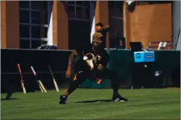  ?? SUZANNA MITCHELL — SAN FRANCISCO GIANTS ?? Giants shortstop Marco Luciano fields a ball during an infield drill at Scottsdale Stadium.