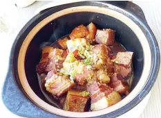  ??  ?? Mao Jia Braised Pork