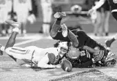  ?? REINHOLD MATAY/ORLANDO SENTINEL ?? Mandarin’s Kasimir Absolou (5) fumbles the ball after a hit by Winter Park’s Dakota Mitchell (25). The Wildcats lost their region semifinal matchup 41-8.