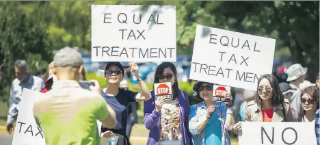  ?? ARLEN REDEKOP ?? Approximat­ely 500 people filled Jericho Hill gym to express their concerns about a proposed school tax hike that would levy an extra 0.2 per cent on homes over $3 million and 0.4 per cent on homes over $4 million. It’s expected the move will generate...