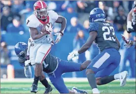  ?? / AP-Bryan Woolston ?? Georgia running back D’Andre Swift runs with the ball during Saturday’s game against Kentucky in Lexington, Ky.