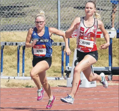  ?? TEAM NOVA SCOTIA PHOTO ?? Sasha Repko of Port Hawkesbury, left, and Kristy Alford of Ontario compete in the second heat of the 200-metre female Special Olympics race at the 2017 Canada Games on Tuesday. Repko placed fifth, while Alford won the race.