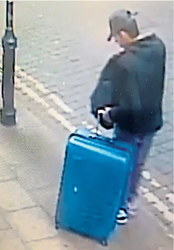  ??  ?? Salman Abedi with the blue suitcase in Manchester city centre on the day he committed his suicide attack