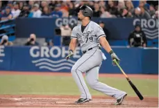  ?? CP PHOTO ?? Chicago White Sox first baseman Jose Abreu watches the flight of his solo home run against the Toronto Blue Jays during the eighth inning of Wednesday’s game in Toronto.