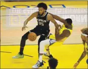  ?? NHAT V. MEYER — BAY AREA NEWS GROUP ?? The Kings’ Marvin Bagley III (35) is called for a charge against the Warriors’ Draymond Green (23) in the first quarter at Chase Center in San Francisco on Monday.