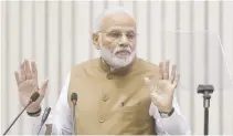  ?? REUTERS ?? INDIA PRIME MINISTER Narendra Modi gestures as he addresses the ‘Global Mobility Summit’ in New Delhi in this Sept. 7 file photo.