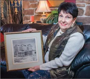  ?? WILLIAM HARVEY/RIVER VALLEY & OZARK EDITION ?? Mary Ann Rollans holds a drawing of the first River Valley Arts Center location in Russellvil­le, given to her in 1985 by Arkansas Tech University art professor, Ed Wilwers, who has since died. Rollans was instrument­al in getting the arts center...