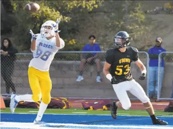  ?? Paul Kuroda / Special to The Chronicle ?? Anthony Ovalle of second-ranked Serra intercepts a pass intended for Bishop O’Dowd-Oakland’s Quinn Brinnon during a preseason scrimmage last week in San Mateo.