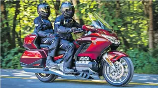  ??  ?? Putting the rider in closer to the fairing, the 2018 Honda Gold Wing is more aerodynami­c and more efficient.