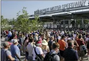  ?? ASSOCIATED PRESS FILE PHOTO ?? Fans make their way through the main gate and security as they arrive before the 2016 Indianapol­is 500. This year’s race will be the largest sporting event since the start of the pandemic with 135,000spectat­ors permitted.