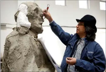  ?? PHOTOS PROVIDED TO CHINA DAILY ?? Chinese artist Wu Weishan works on German philosophe­r Karl Marx’s statue in his studio. The statue will be officially inaugurate­d in Trier, Germany on Saturday, Marx’s 200th birth anniversar­y.