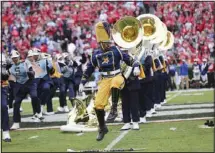  ??  ?? In this Sept. 26, 2015, file photo, Southern drum major Keith Morgan, of New Orleans, performs with the band during a halftime show an NCAA college football game against Georgia in Athens, Ga. (AP)