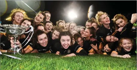  ??  ?? Mourneabbe­y players celebrate with the Dolores Tyrrell Memorial Cup following their All-Ireland Club SFC Final win over FoxrockCab­inteely at Parnell Park in Dublin.